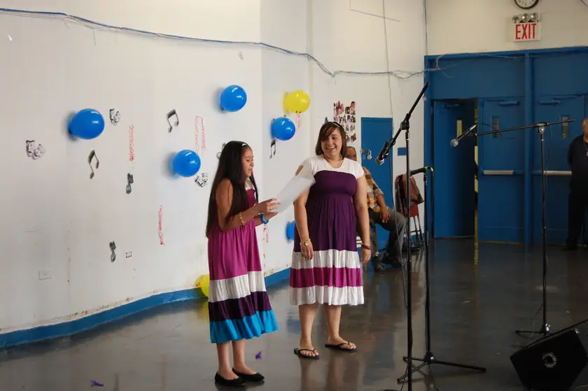 A solo performance, mentor standing by