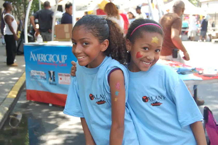 Face paint and programme shirts at the fair