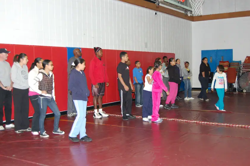 Lining up across the gym for warm-ups