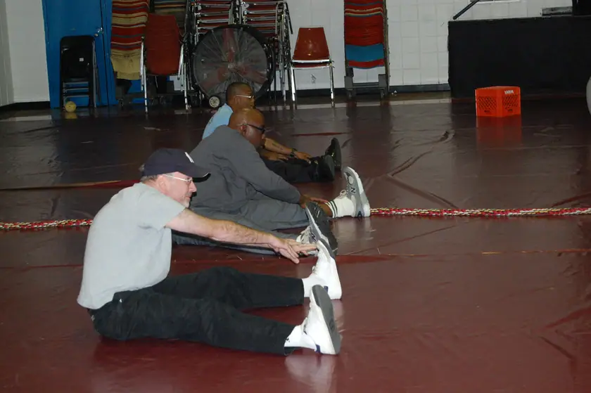 The coach leads a stretch