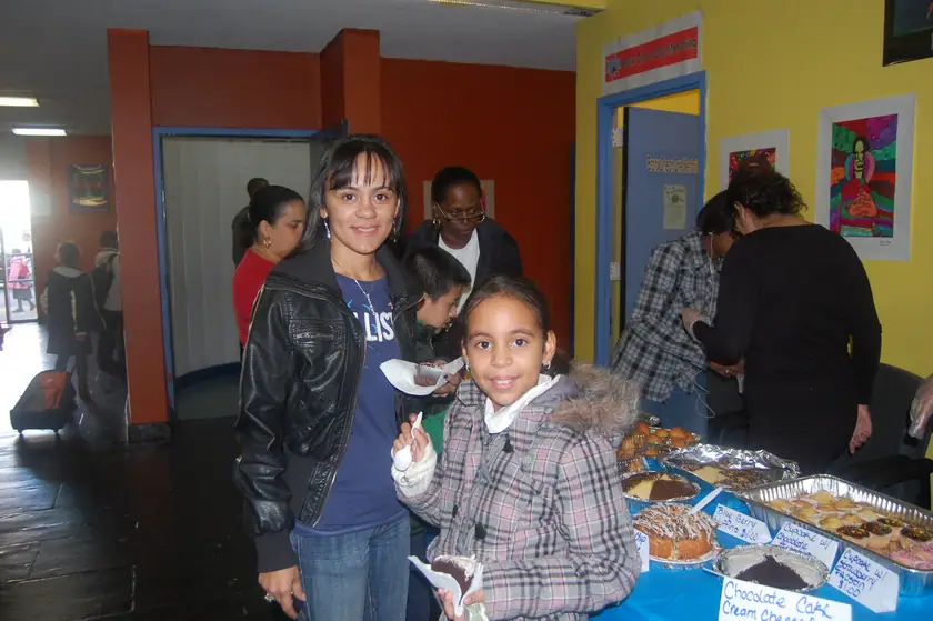 Families at the bake-sale table