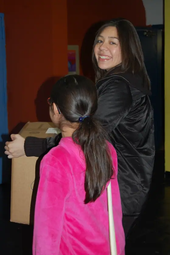 A mother and daughter carry one out