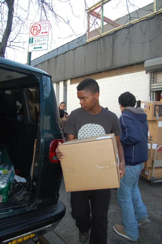 Carrying a box away from the van