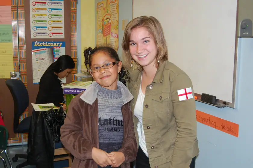 A mentee and her mentor by the whiteboard