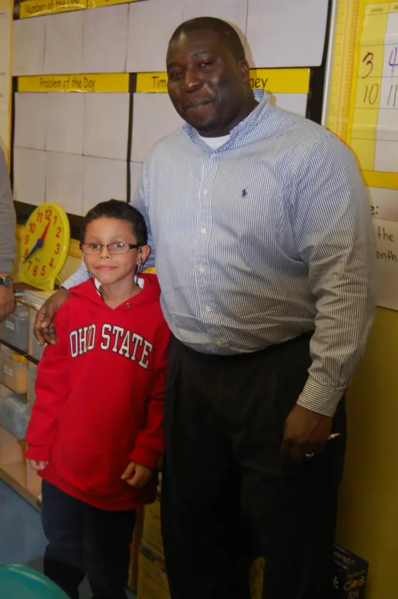 A mentor and his mentee at the classroom door