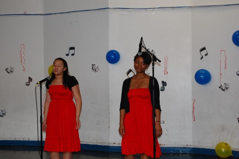 Two BOOM mentees perform together on the talent show stage.